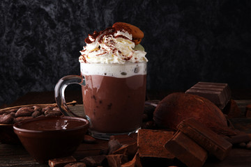 Hot chocolate or coffee with whipped cream in glass