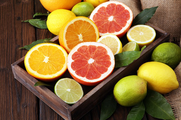 Naklejka na ściany i meble Citrus background. Assorted fresh citrus fruit. Lemon, orange lime, grapefruit. Fresh and colorful concept.