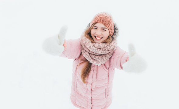 Young positive girl shows gesture hands, super, class, winter morning, happy beautiful, the picture for advertising,