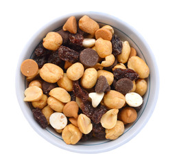 Mix nuts, dry fruits and grapes in white bowl on a white background