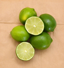 Fresh ripe lime isolated on brown paper