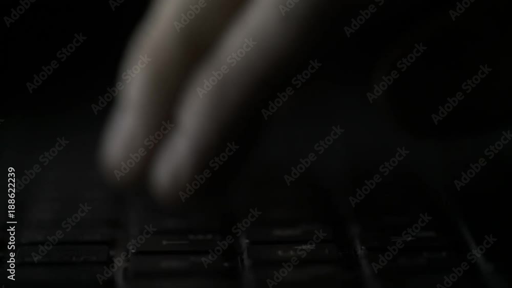Poster finger pressing computer keyboard. male hand is writing text on a laptop macro. fingers pressing key