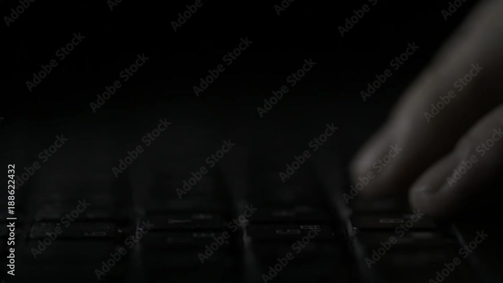 Poster finger pressing computer keyboard. male hand is writing text on a laptop macro. fingers pressing key