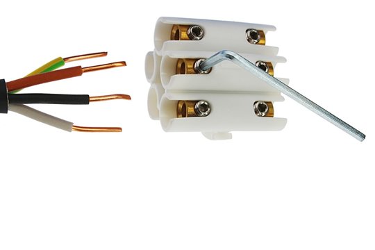 Four wired copper electric cable and plastic white cable joint with brass sockets and allen key screws for fastening, white background.