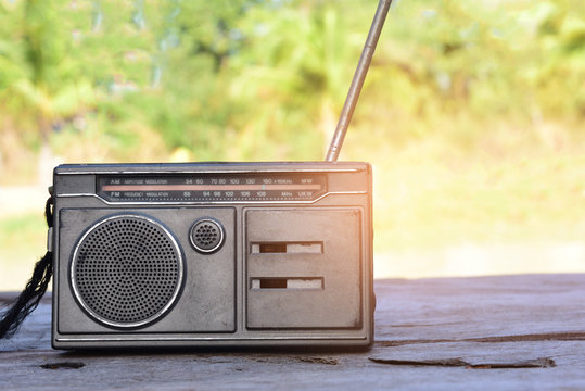 radio vintage pace on old wood,The backdrop is a field.