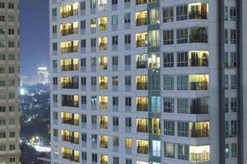 Residential apartment windows at night for electrical and power energy concept.  Individual living...