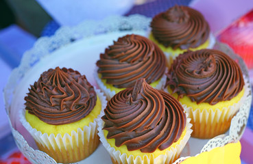 Platter of chocolate cupcakes with buttercream frosting