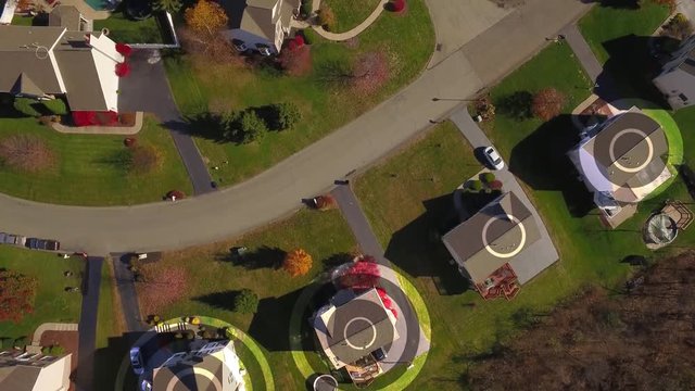 An aerial bird's eye view establishing shot of a typical Pennsylvania residential neighborhood with WiFi hotspot markers over random homes. Pittsburgh suburbs.	