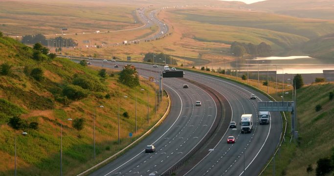 Cars & Lorries On M62 Motorway & Booth Wood Resrvoir; M62 And Reflections; West Yorkshire, England
