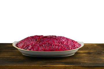 Russian traditional multicomponent salad with boiled vegetables and herring.