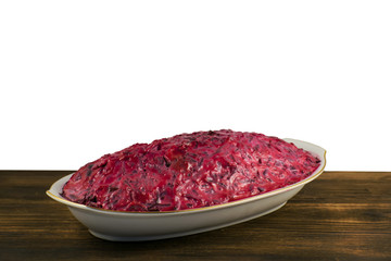 Russian traditional multicomponent salad with boiled vegetables and herring.
