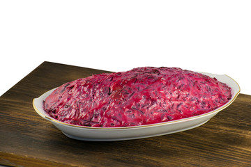 Russian traditional multicomponent salad with boiled vegetables and herring.