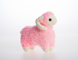 toy or goat or sheep on a background.
