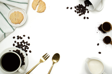 Top view mockup on white background with a cup of coffee, coffee beans, milk and cookie.