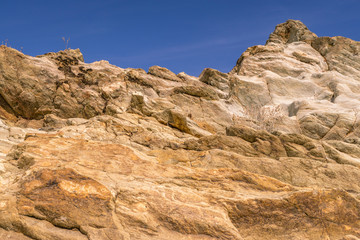 Fototapeta na wymiar rock wall with blue sky