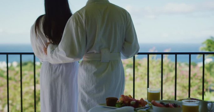Couple relaxing enjoying morning on vacation at luxury hotel