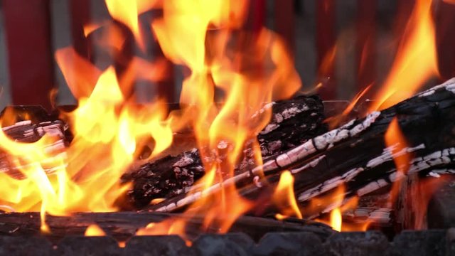 Open fire in iron barbecue stove