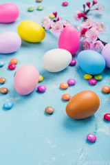 Colorful decorative eggs on spring background