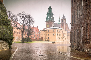 Fototapeta na wymiar Wawel castle in Krakow during a snowy day at Christmas, the historic Polish city, Europe.