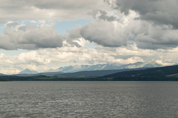 Fototapeta na wymiar Orava reservoir with mountains of High Tatras