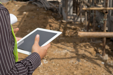 construction engineer worker using tablet computer at building site