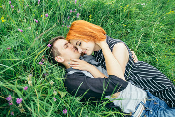 couple lie on the grass