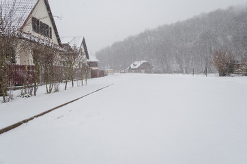 Fototapeta premium winter scene in backyard, snow covered street neighborhood