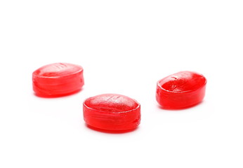 Red candies isolated on white background
