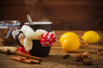 Cup with scarf with hot tea.