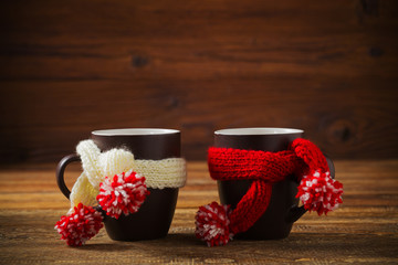 Cup with scarf with hot tea.