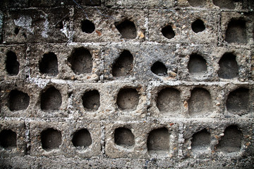 stone wall with holes, rough background