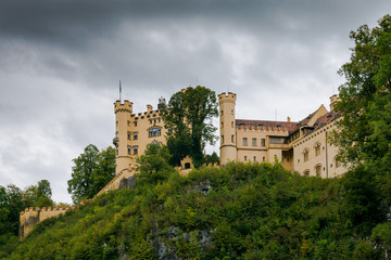 Castle Hohenschwangau in Germany. The Royal Palace in Bavaria. The yellow famous palace is a tourist attraction. 
