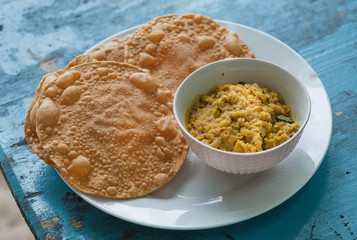 Indian food for breakfast. Papadum bread and vegetarian dal made from lentils or beans. Also popular in Nepalese, Pakistani, Sri Lankan and Bangladeshi cuisines