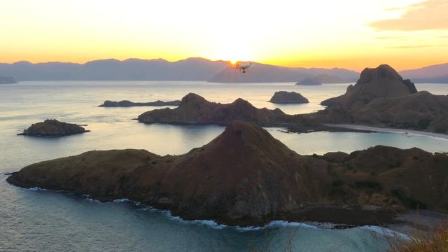 Drone pilot with high resolution camera flying over padar island in Komodo, Indonesia. zoom in
