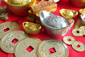 Gold and money coin on red pocket 