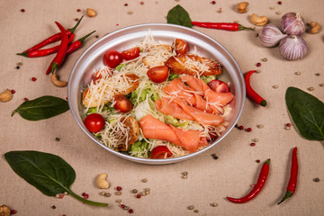Caesar salad with salmon fish