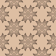 Brown floral ornament on beige background. Seamless pattern