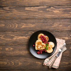 Valentine's day background with delicious pancakes in form of heart. Valentines day concept greeting card. Top view. Copy space.