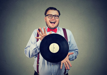 Eccentric man excited with vinyl disk