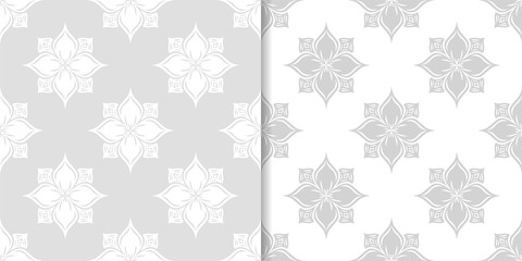 Light gray floral backgrounds. Set of seamless patterns