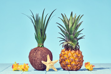 Tropical Pineapple and Coconut. Bright Summer Color. Creative Minimal. Hot Summer Vibes. Sunny Beach background. Trendy fashion Style.
