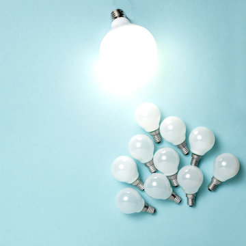 One light bulb outstanding, glowing different. Business creativity idea concepts.