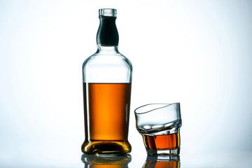 The curved glass of whiskey or alcohol drink