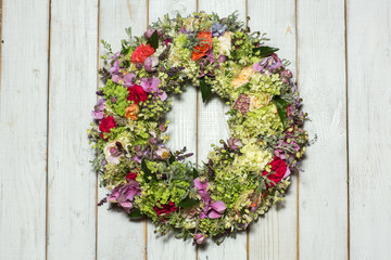 Fototapeta na wymiar a beautiful flower wreath isolated on awooden background