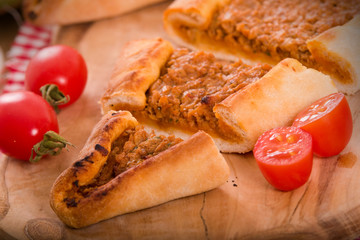 Turkish pide pizza with meat and onion. 