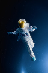 Astronaut floating in outer space , high contrast image © fergregory