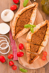 Turkish pide pizza with meat and onion. 