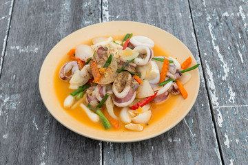 Stir fried squid with salted egg yolk, Thai seafood cuisine
