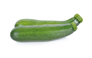 whole fresh zucchini on white background