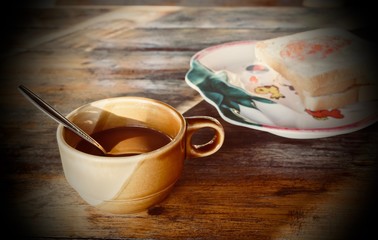 Cup of coffee and toast for breakfast.
